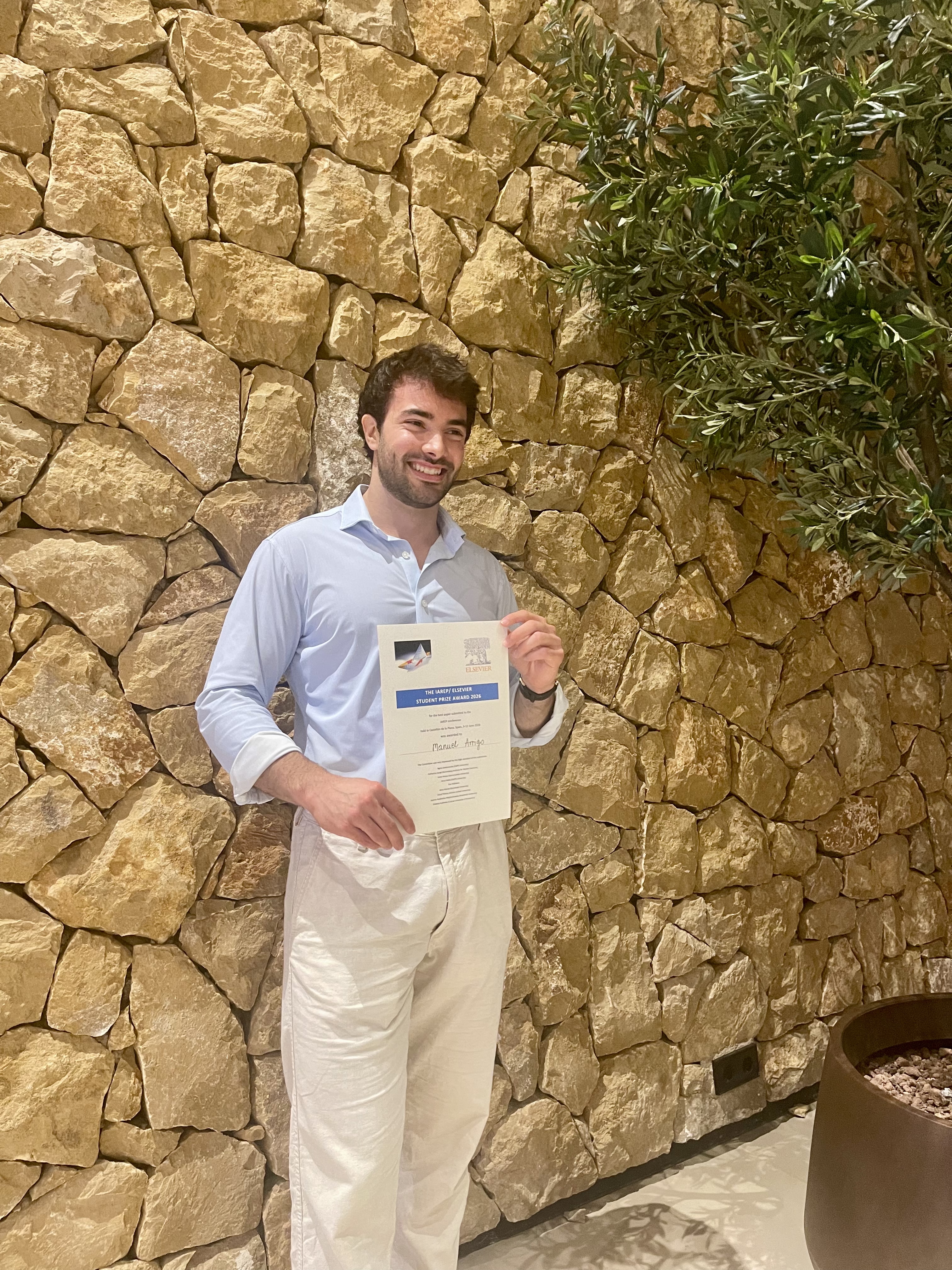 Manuel Arrigo with the IAREP Elsevier Student Prize certificate